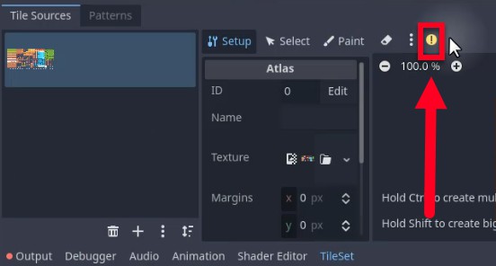 Aquesta imatge mostra la interfície de l'editor TileSet de Godot, concretament la pestanya "Fonts de rajoles", on es ressalta una icona d'advertència (un signe d'exclamació groc dins d'un cercle vermell) amb una fletxa vermella que apunta cap a ella, que indica un problema amb la configuració de l'atles de rajoles. El tauler de l'Atles mostra l'ID 0 sense cap nom assignat, i el seu camp Textura mostra una miniatura d'un full de sprites; Els marges s'estableixen en x: 0 px i y: 0 px. Aquesta advertència probablement es relaciona amb els errors d'execució mostrats anteriorment sobre les fitxes que es troben fora dels límits de la textura, cosa que suggereix que l'usuari ha d'ajustar l'atles o la col·locació de les fitxes per resoldre les coordenades de les fitxes no vàlides abans de continuar amb el moviment del jugador o el disseny de nivells.