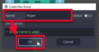 Aquesta imatge mostra el diàleg "Crea un grup nou" de Godot, on l'usuari està assignant el node Jugador a un grup anomenat "Jugador"; el camp Nom conté "Jugador", un missatge de validació verd confirma que "El nom del grup és vàlid.", i el botó D'acord es ressalta amb un cursor, que indica el pas final per confirmar l'addició del jugador a aquest grup perquè l'script _on_body_entered de l'enemic pugui identificar-lo mitjançant body.is_in_group ("Jugador").