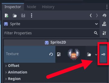 Aquesta imatge mostra el tauler d'inspector de Godot per a un node Sprite2D, amb la propietat "Textura" ampliada i el seu valor es mostra com una petita miniatura de vista prèvia d'un sprite de caràcter; una fletxa vermella apunta al botó "Edita" (una icona de clau anglesa) al costat del camp de textura, que indica que l'usuari està a punt de modificar o configurar l'actiu de textura del sprite, probablement en preparació per animar el comportament visual de l'enemic després de la detecció de col·lisions, com a part de la lliçó en curs sobre la implementació de la interacció jugador-enemic.