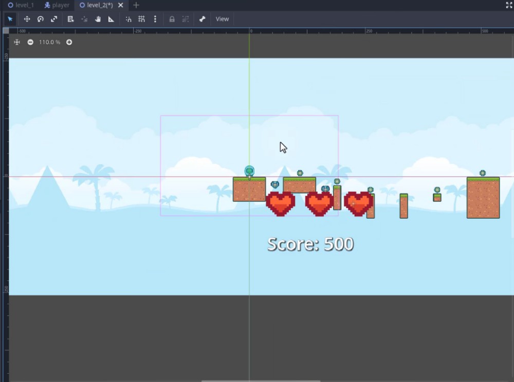 A la vista d'escena 2D de l'editor Godot, l'usuari està editant "level_2(*)", amb la finestra gràfica ampliada al 110,0% i mostrant un disseny de nivell temàtic del desert amb plataformes d'art de píxels, monedes, enemics i tres indicadors de salut en forma de cor per sobre d'una etiqueta de text "Puntuació: 500"; el mapa de fitxes s'ha modificat des del tema del bosc original mitjançant fitxes del desert, i els elements del joc com monedes i enemics es col·loquen a través del terreny, amb un quadre de selecció visible al voltant d'una part de l'estructura de la plataforma, que indica l'edició activa de la ubicació o les propietats del node com a part de la personalització del nivell duplicat.