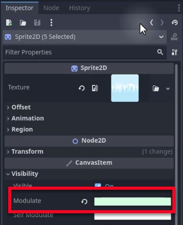 Al panell Inspector de l'editor Godot, es mostren cinc nodes Sprite2D seleccionats amb les seves propietats compartides visibles; el camp de propietat "Modular" està ressaltat en un quadre vermell i actualment està buit, indicant que està preparat per a l'entrada per ajustar el to de color dels sprites de fons; aquest pas segueix la substitució del fons del bosc per sprites temàtics del desert per diferenciar visualment el nivell 2 del nivell 1.
